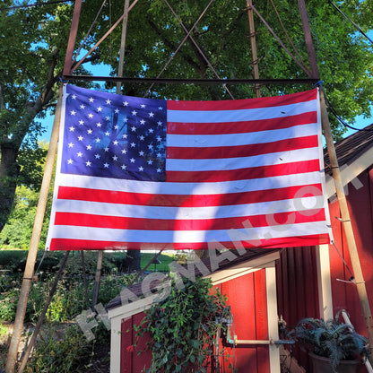 Heavy duty ventilated American flag for wind relief during aerial display