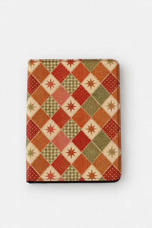 A rectangular tablet case featuring a vintage-style patchwork argyle pattern with red, orange, green, and beige diamond sections, set against a plain light gray background.