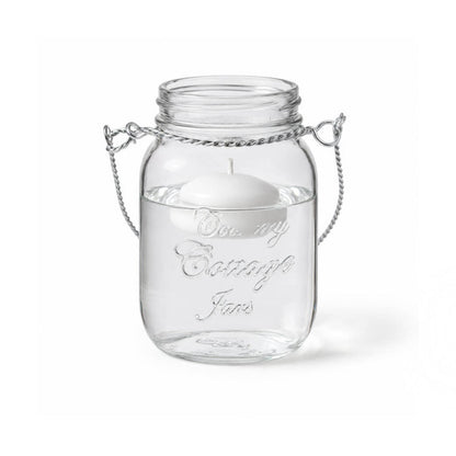 A Small Mason Jar with Handle and floating white candle