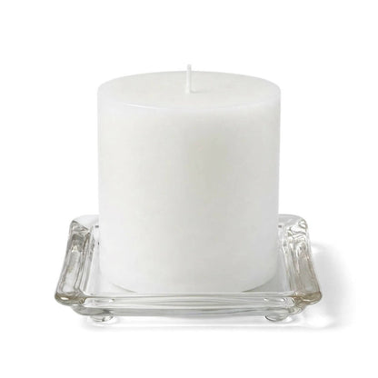 5" square glass pillar plate with a white candle on a white background