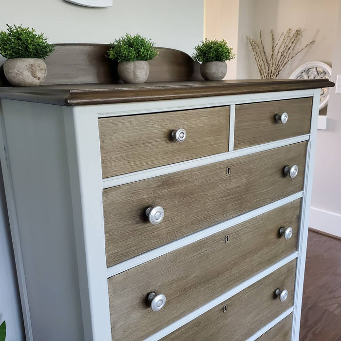 Retique It Dove Grey furniture and cabinet paint in a quart, shown on a corner of a dresser for a smooth, elegant finish.