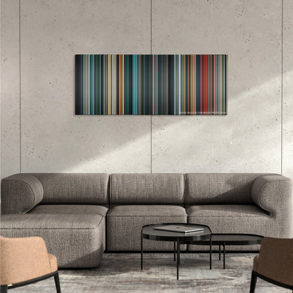 Justice League color palette canvas on a concrete wall above a gray sectional sofa