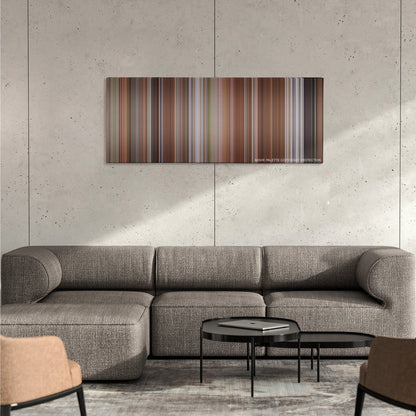 Liar Liar color palette canvas on a concrete wall above a gray sectional sofa