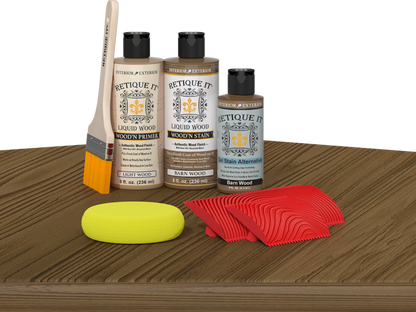 Retique It Wood'n Finish Kit in Barn Wood on table, showcasing multi-purpose wood finishing kit with rustic wood appearance.