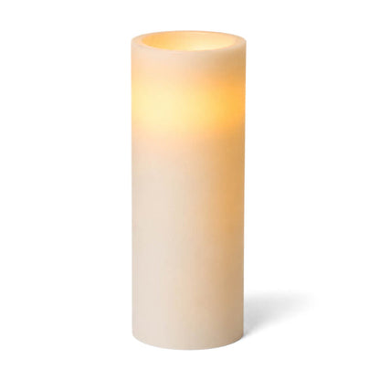 Tall glowing white LED pillar candle on a clean background