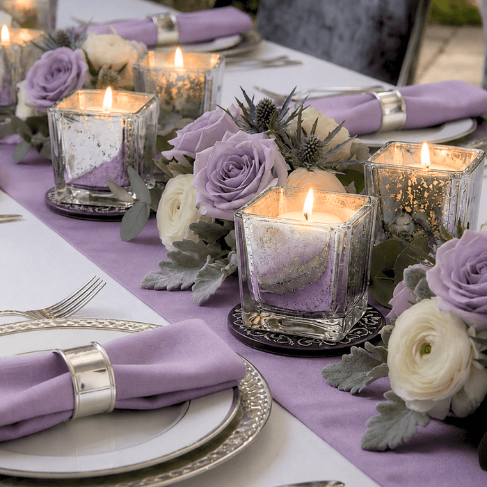 Lavender floral table setting with glowing mercury glass candle holders and roses