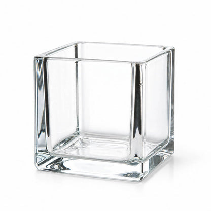 Empty 4" square glass cube vase on a white background