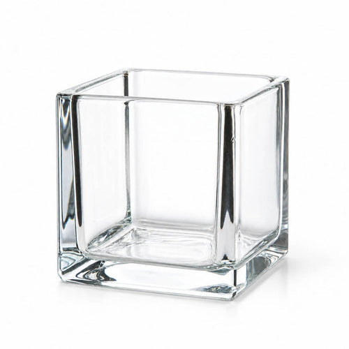 Empty 4" square glass cube vase on a white background