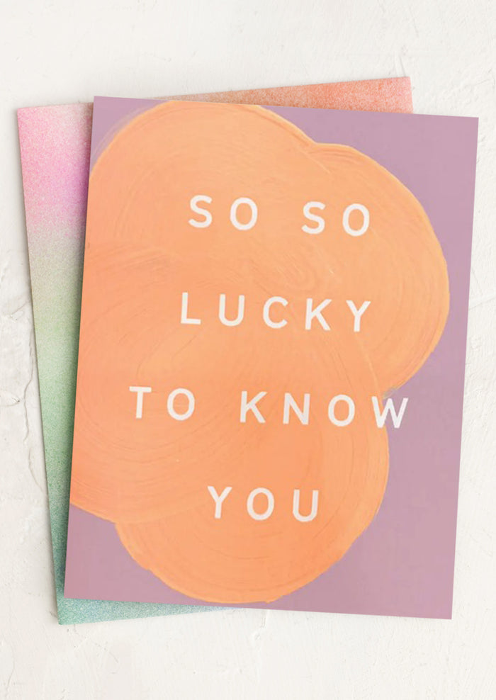 Greeting card with 'So so lucky to know you' text on a pastel background