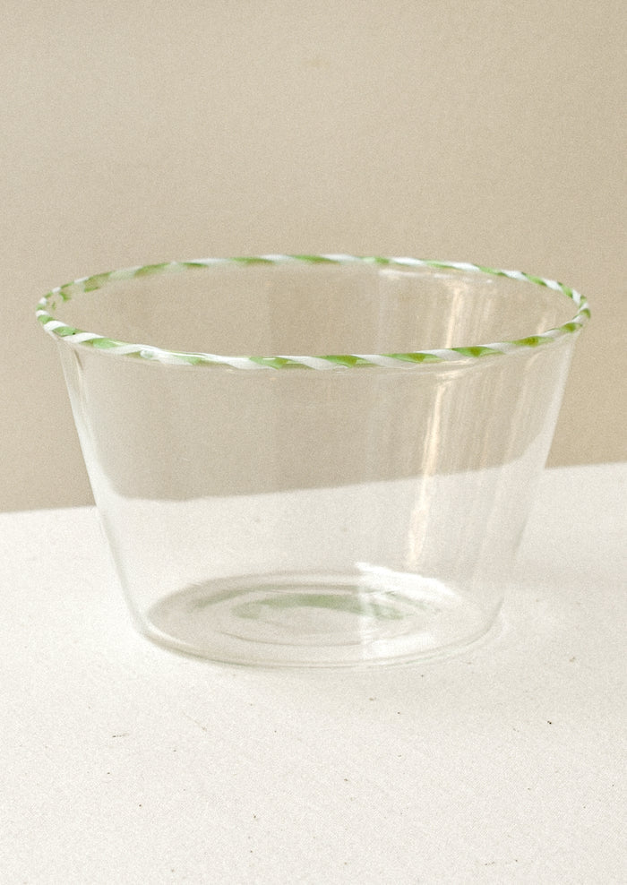 Clear glass blow with a green striped rim
