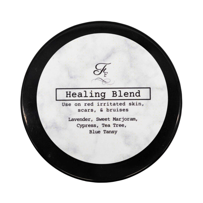 Round container labeled 'Healing Blend' with black lid on a white background
