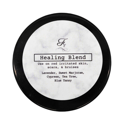 Round container labeled 'Healing Blend' with black lid on a white background