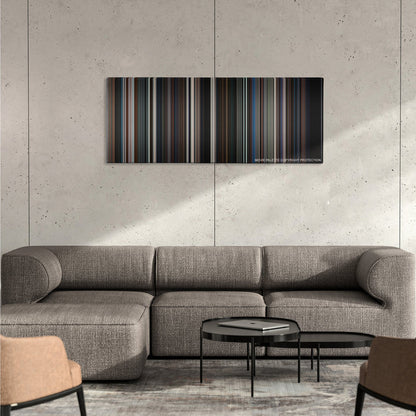 The Dark Knight color palette canvas on a concrete wall above a gray sectional sofa