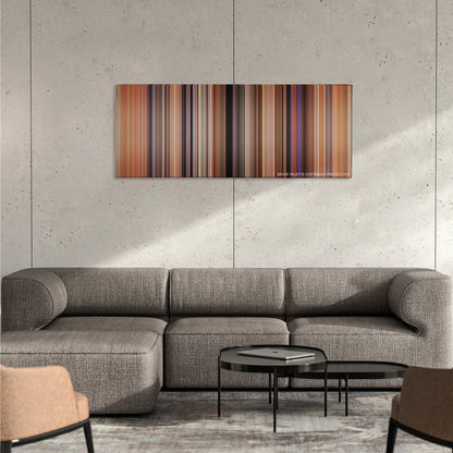 There's Something About Mary color palette canvas on a concrete wall above a gray sectional sofa
