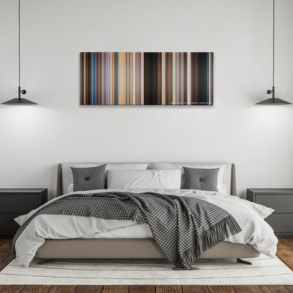 We're the Millers color palette canvas above a bed, between two black pendant lamps
